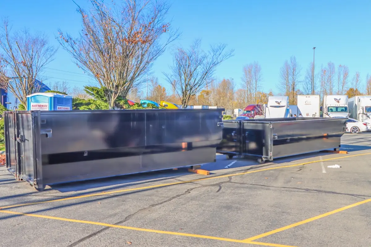 Professional dumpster rental service with roll-off container on residential driveway in Chino Hills